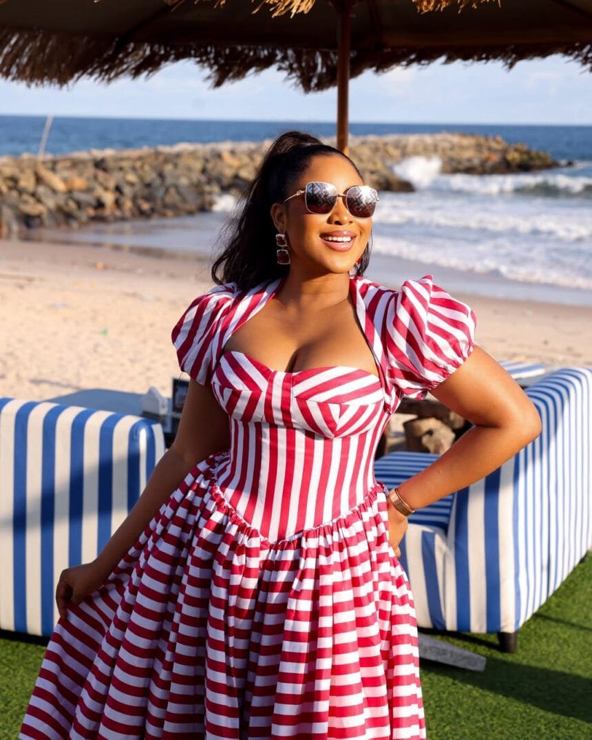 Erica Nlewedim Makes a Striped Milkmaid Dress the Ultimate Beach Holiday Statement